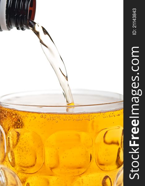 Fresh glass of beer isolated on a white background