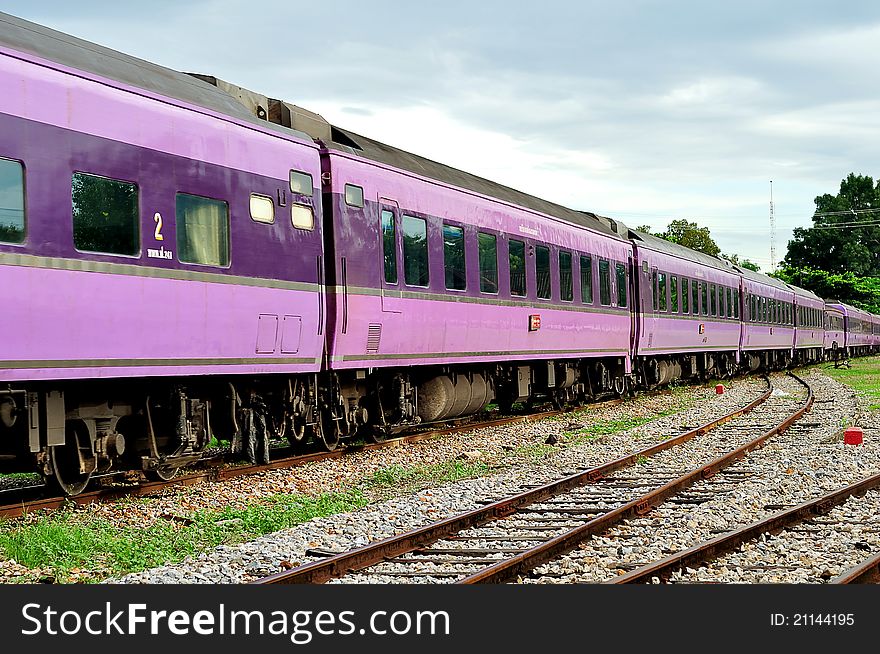 A purple bogie train moving to next station, Chiangmai train station, Thailand