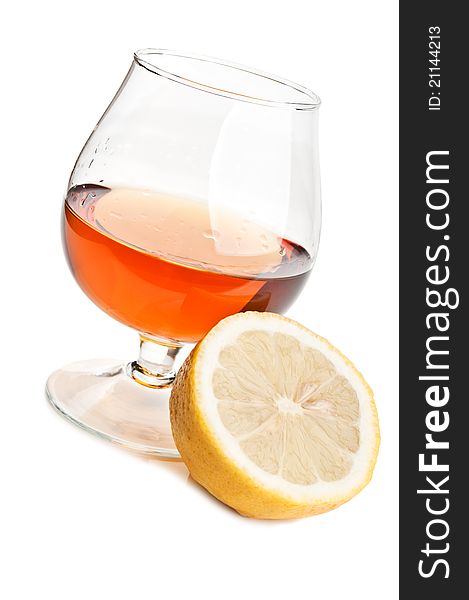 Whiskey and lemon isolated on a white background