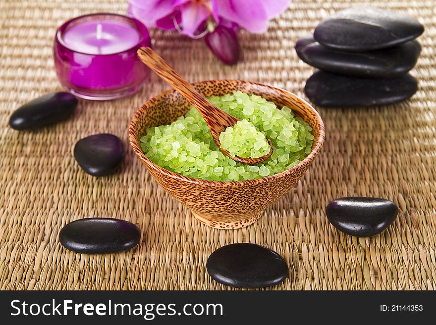 Spa Concept - Zen Stones and Relaxing Salt in Wooden Bowl