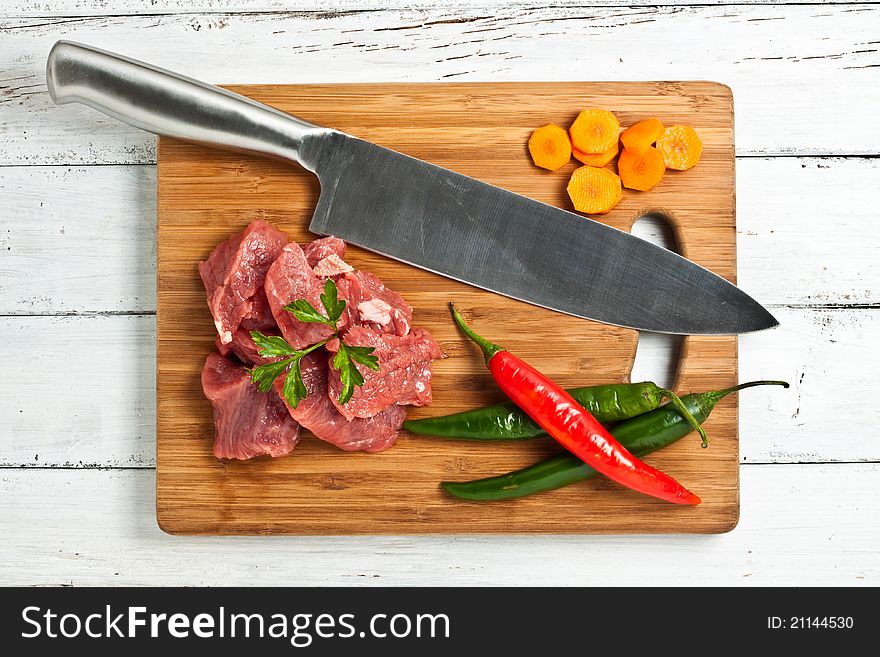 Chopped raw meat on a chopping board. Chopped raw meat on a chopping board