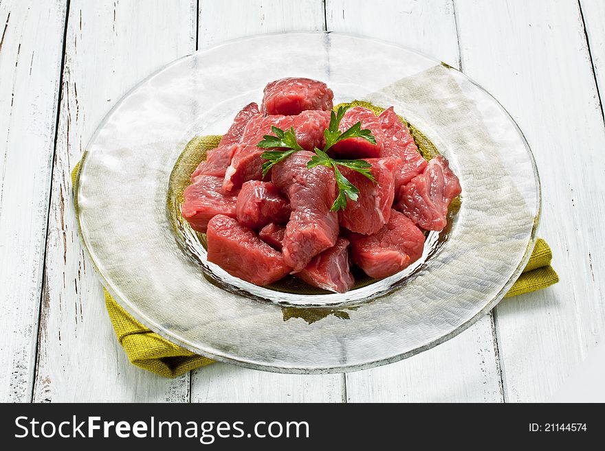 Chopped raw meat on a glass dish. Chopped raw meat on a glass dish