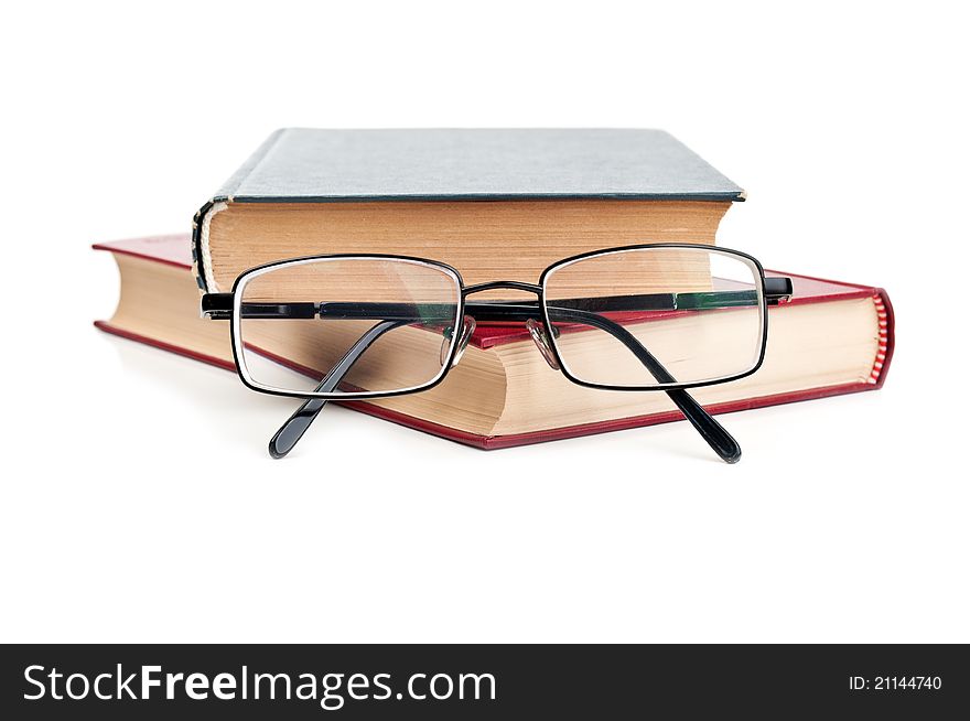 Glasses and red book isolated on a white background