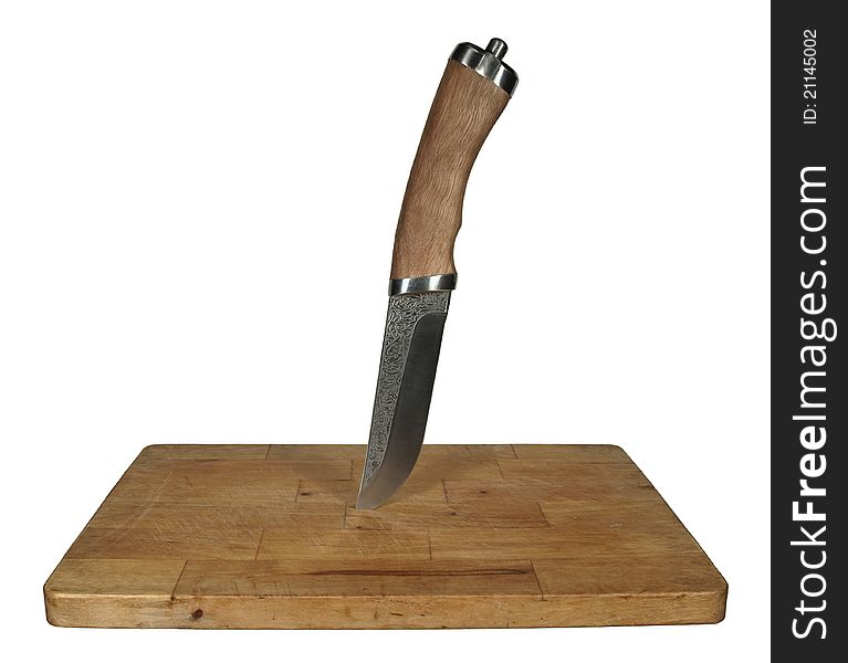 Steel knife with wooden handle stuck in the old cutting board. Steel knife with wooden handle stuck in the old cutting board.