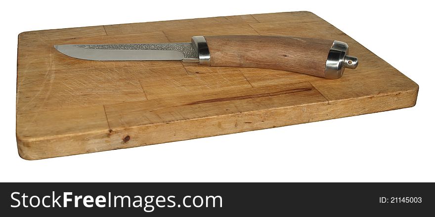 Steel knife with wooden handle is on an old cutting board. Steel knife with wooden handle is on an old cutting board.