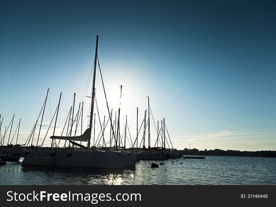 Yachts on an anchor in harbor, boats series