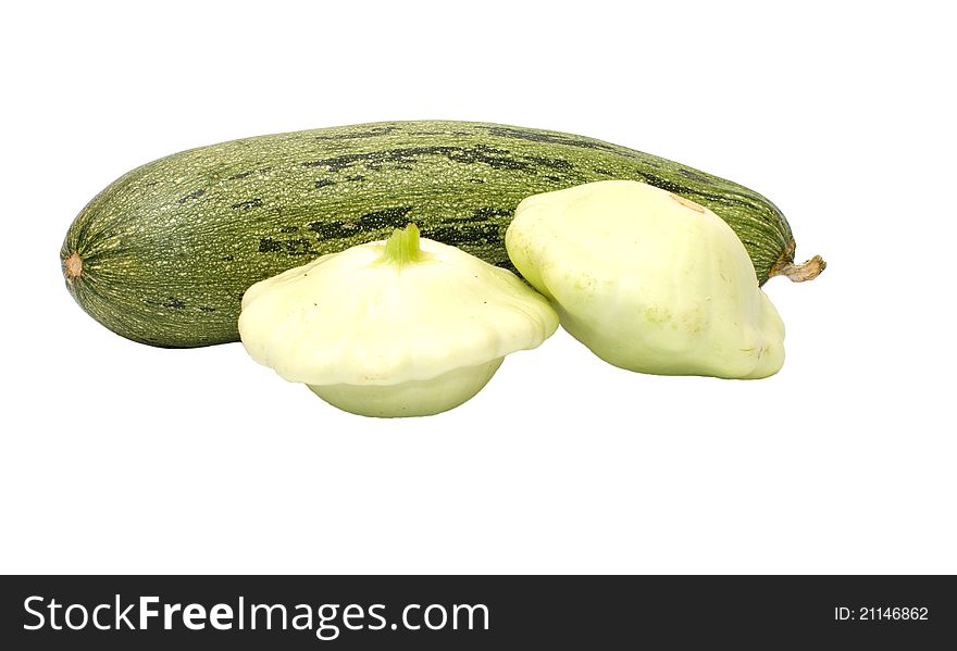 Zucchini and two bush pumpkins it is isolated on a white background. Zucchini and two bush pumpkins it is isolated on a white background.
