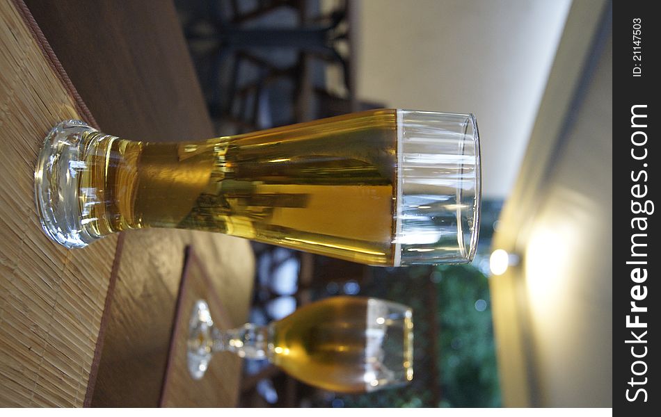 Two glasses of beer on the table in a restaurant. Two glasses of beer on the table in a restaurant