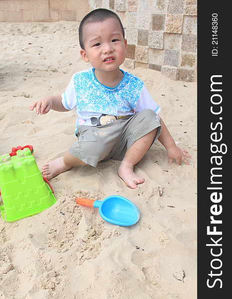 Kid play sand in the beach. Kid play sand in the beach