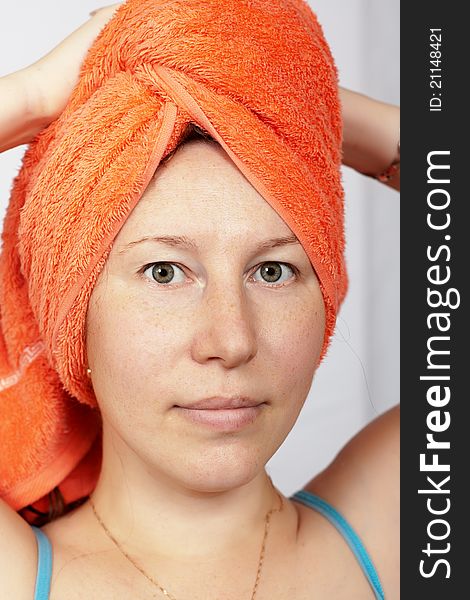 Woman after a shower with a towel on his head