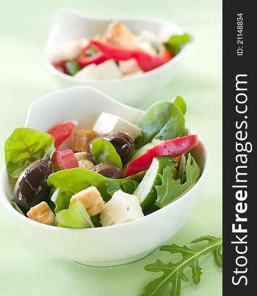 Fresh vegetable salad with calamata olives, crouton and cheese. Selective focus