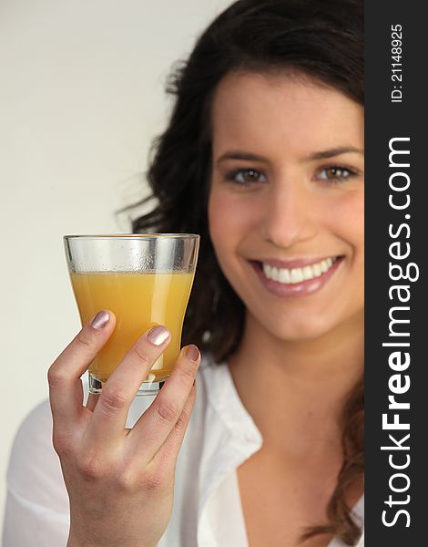 Woman Holding A Glass Of Orange Juice