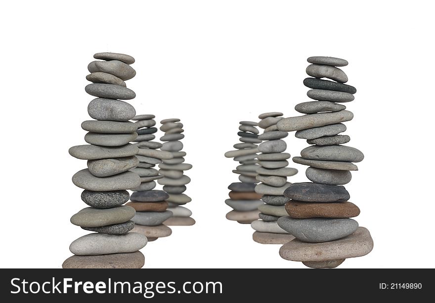 Four towers from stones on white background