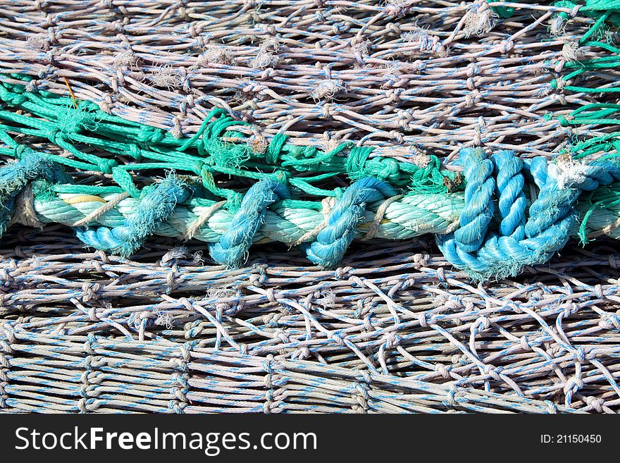 Fishing nets on pier at Burghead harbour, Moray, scotland. Fishing nets on pier at Burghead harbour, Moray, scotland