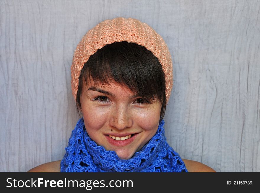 A girl in a warm knitted hat and scarf. A girl in a warm knitted hat and scarf