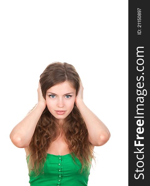 Portrait of attractive teenage girl with hands on ears, isolated over white background