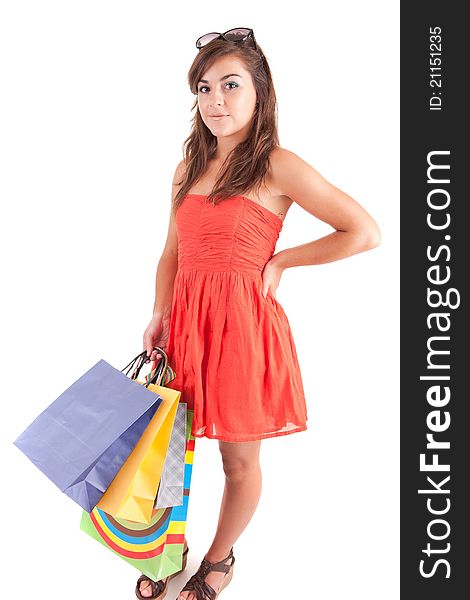 Young woman with shopping bags, isolated over white