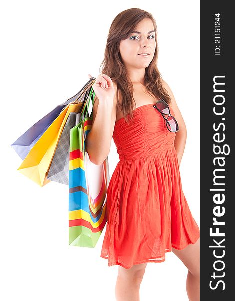 Young woman with shopping bags, isolated over white