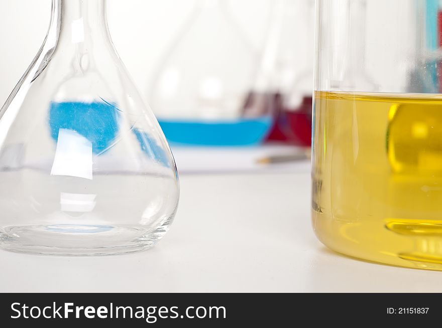 Laboratory items, flask with yellow liquid