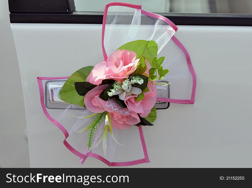 Beautiful wedding flowerses on handle of the car. Beautiful wedding flowerses on handle of the car