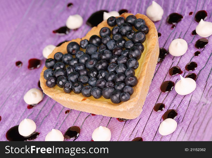 Cream and blueberry heart-shaped tart