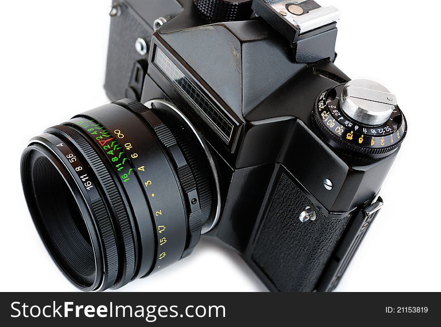 Close-up view of a classic manual SLR film camera isolated on white background