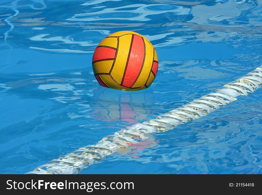 Water polo ball in a swimming pool. Water polo ball in a swimming pool