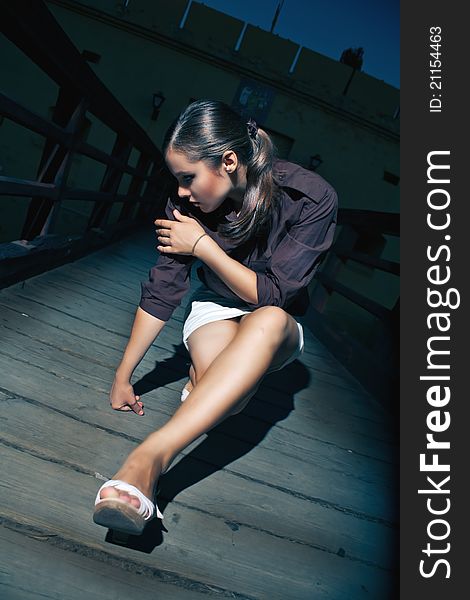 Glamour Photo Of Girl Sitting On The City Bridge