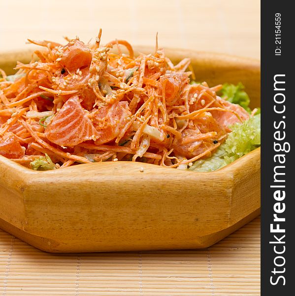 Salad with sashimi of salmon, carrots and sesame seeds. Salad with sashimi of salmon, carrots and sesame seeds