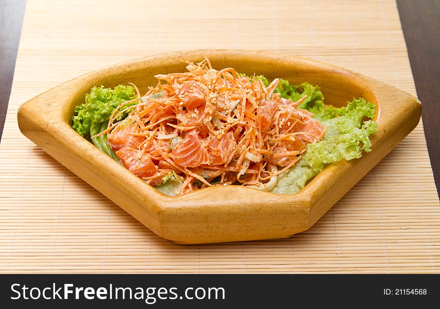 Salad with sashimi of salmon, carrots and sesame seeds. Salad with sashimi of salmon, carrots and sesame seeds