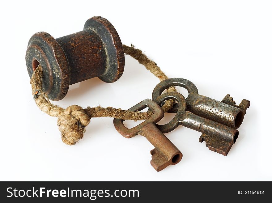 Bunch of old keys on bright background