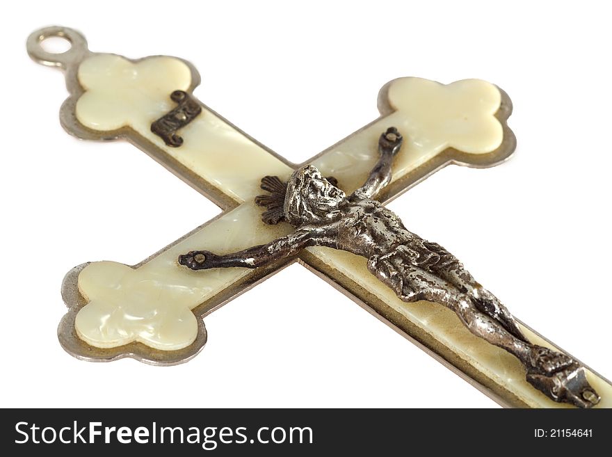 Pearly crucifix isolated on white background
