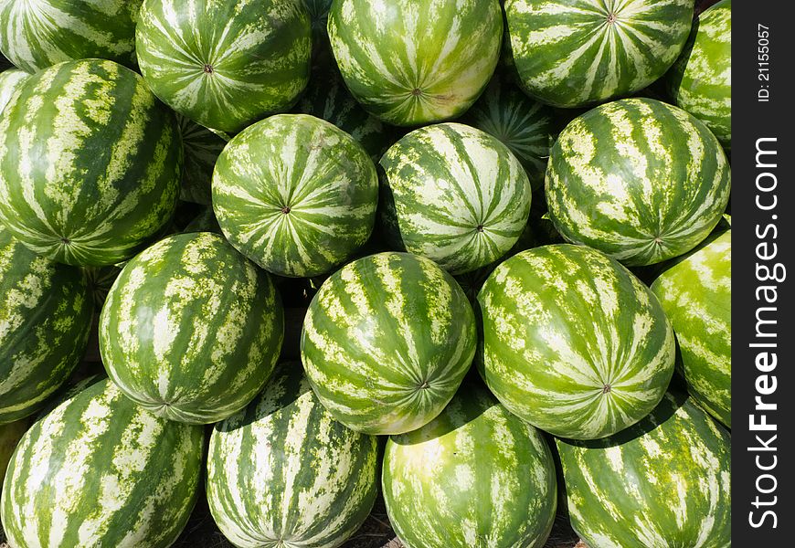 Watermelons arranged on street market. RAW format present. Watermelons arranged on street market. RAW format present