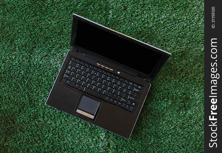 A laptop computer on a work desk