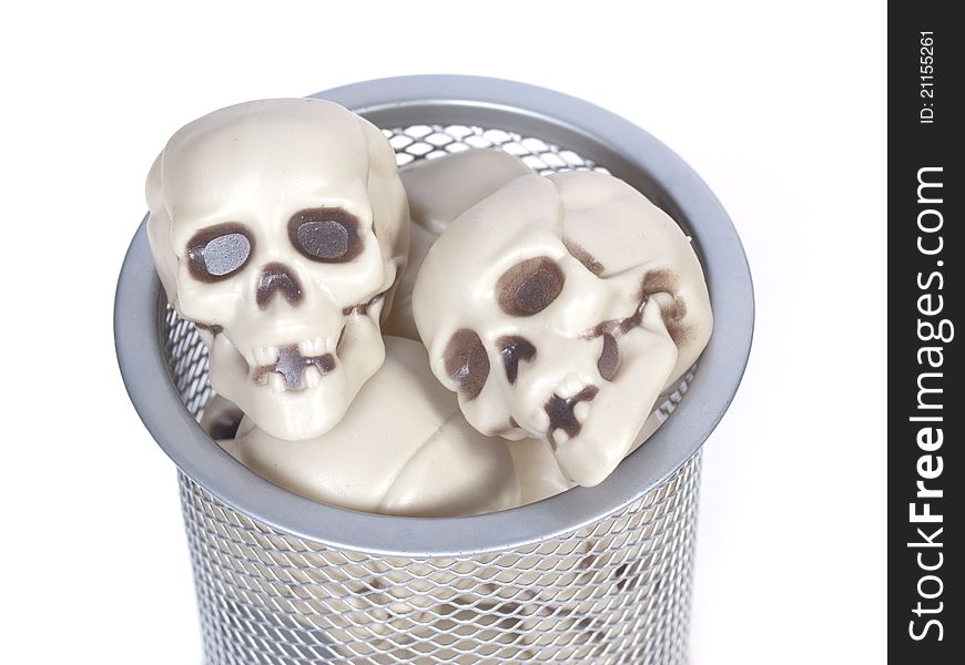 Human Skulls In A Wastebasket