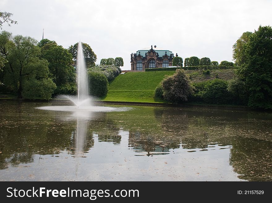 Lake with a fountain in a park in Dresden Zwinger