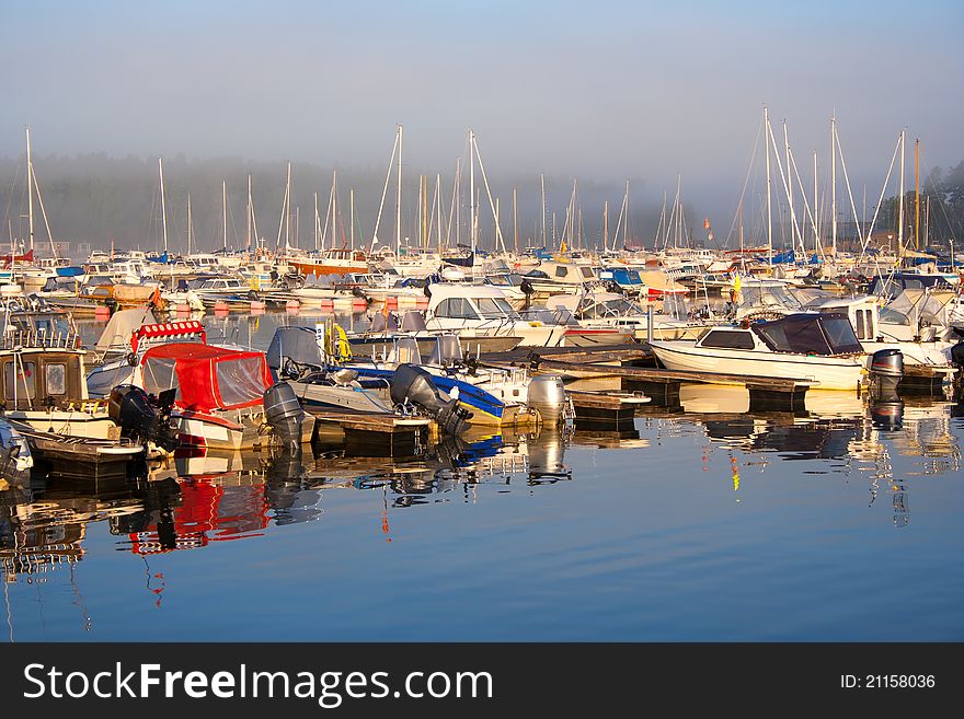 Boat Harbor In Foggy Morning