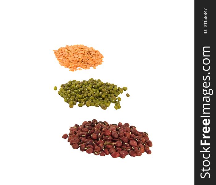 Red, green, yellow peas on the white background