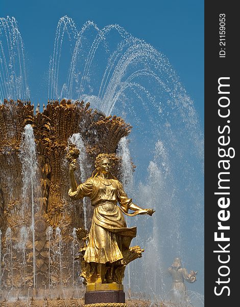 Sculpture of the woman on a background of a fountain. Sculpture of the woman on a background of a fountain