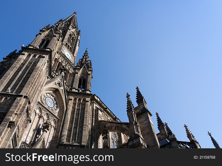 Low-angle shoot of an old cathedral and blue sky in the background