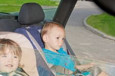 Two Little Kids On Back Seat In Child Safety Seat Stock Photo