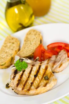 Pork Chop, Grilled ,with Salad,bun And Tomato Stock Photo