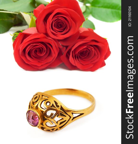 Roses and golden ring isolated on white background