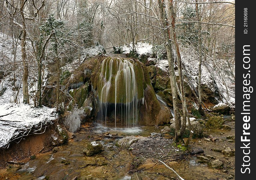 Falls in the winter forest