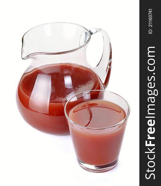 Plum juice in a jug and a glass