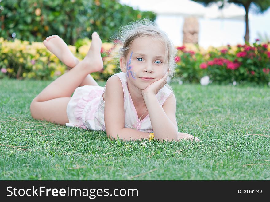 Portrait of a beautiful girl with flower paining on her face