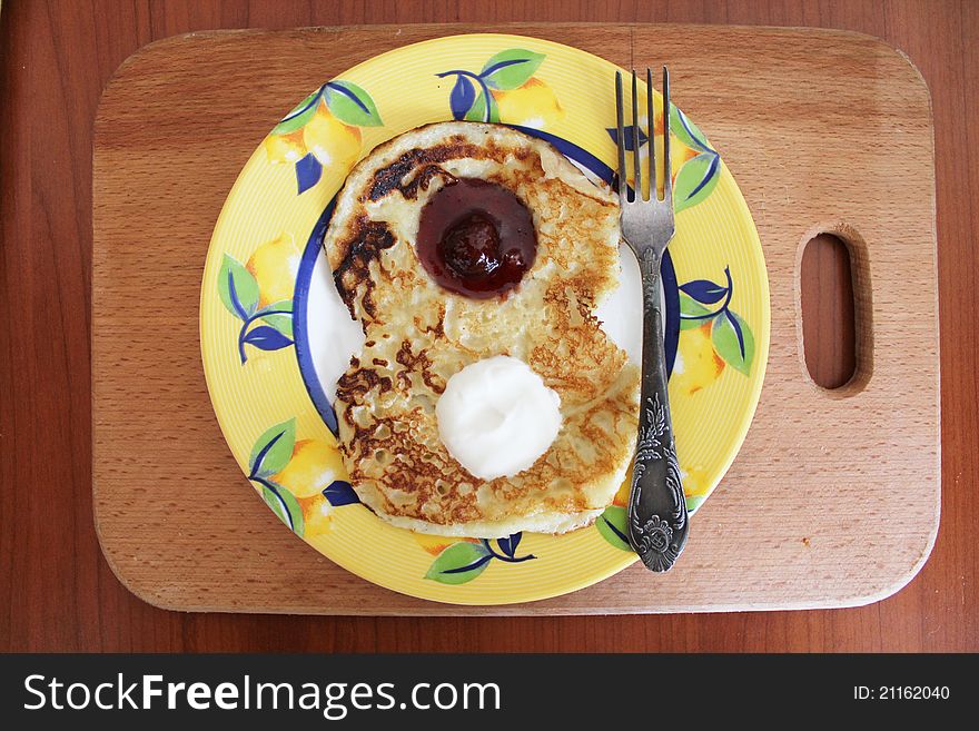 Pancakes with sour cream and jam on March 8