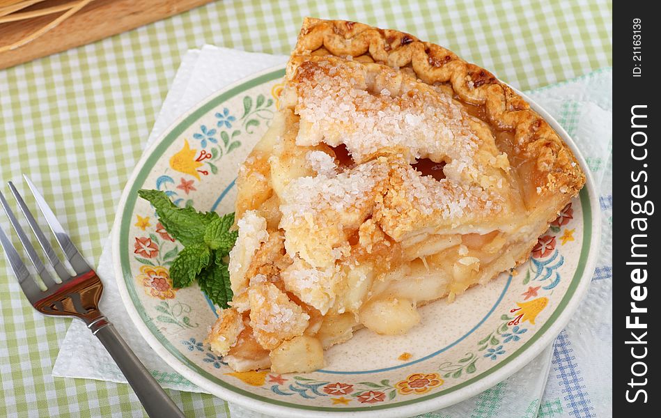 Top view of a slice of apple pie on a plate. Top view of a slice of apple pie on a plate