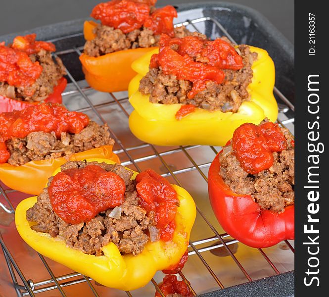 Baked stuffed bell peppers on an baking pan. Baked stuffed bell peppers on an baking pan