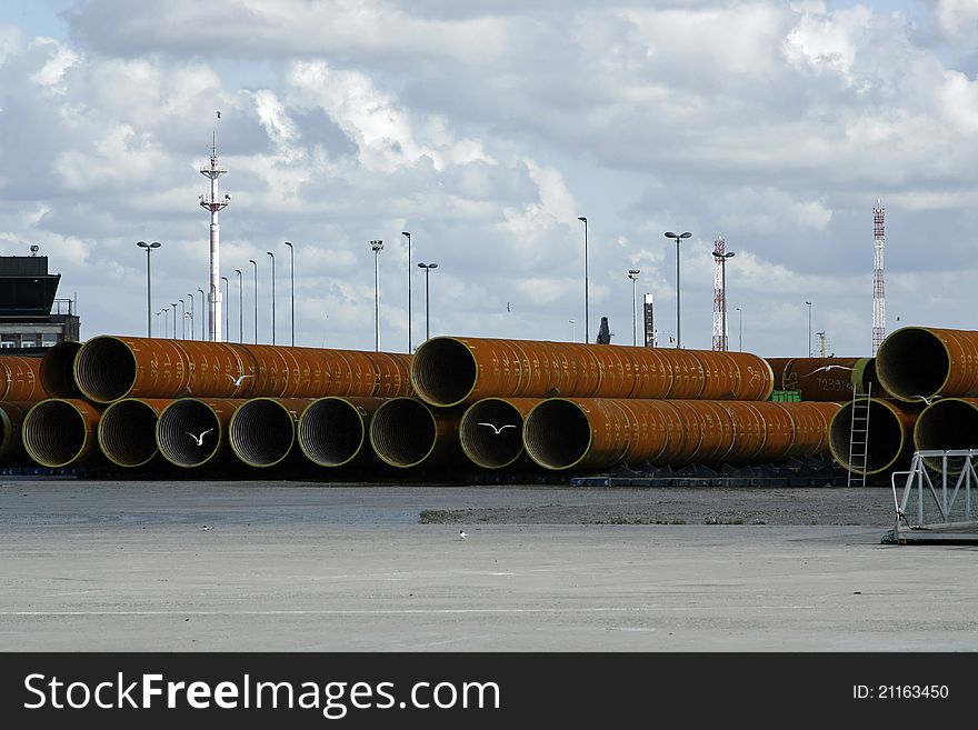 Large pipes ready to be transported, and playground for gulls. Large pipes ready to be transported, and playground for gulls